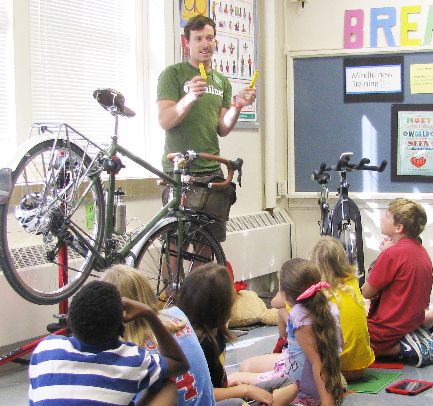 Taylor March leads a youth fix-a-flat course for Trailnet