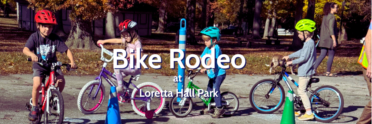 Kids riding bikes with helmets.